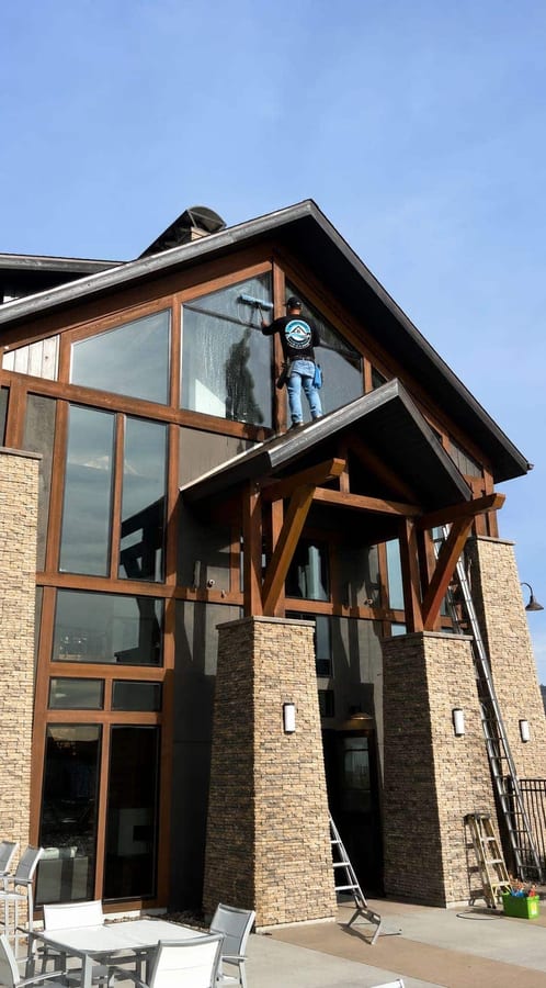 Commercial window cleaning on tall exterior glass